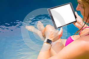 Woman using smartwatch and tablet computer