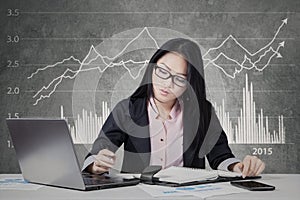 Busy worker with financial statistic background photo