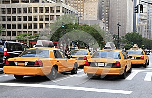 Busy yellow taxis in traffic, New York City