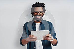 Busy young African man in eyewear