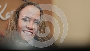 Busy young business woman working at desk typing on a laptop Close Up