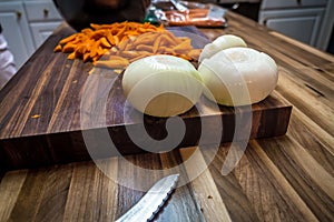 Butcher block cutting board with vegetables