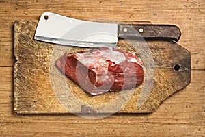 Butcher kife and raw meat