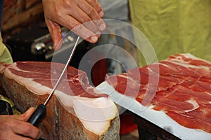 Butcher knife cut large slices of ham to sell