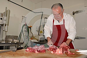 Butcher prepares boneless chuck roasts