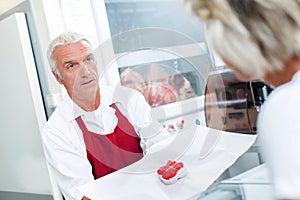 butcher serving customer