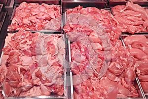 Butcher shop fridge counter with cold raw meat