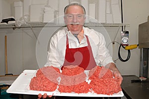 Butcher showing ground beef