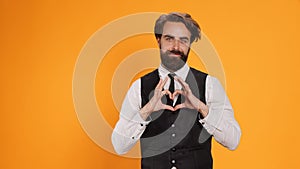 Butler indicates heart shaped sign