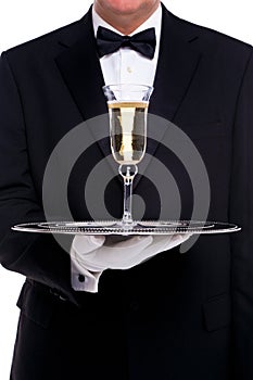 Butler serving a glass of champagne