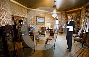 Butler or Waiter Staff in Victorian Mansion Parlor