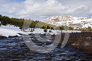 Snowcapped Beartooth Butte and river photo