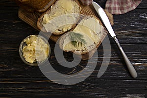 Butter, bread, parsley traditional   on a wooden background sliced