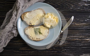 Butter, bread, parsley kitchen   traditional  gourmet   on a wooden background sliced