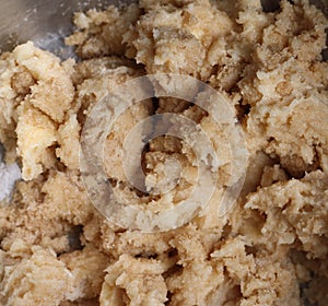 Butter, brown and white sugar mix in mixing bowl