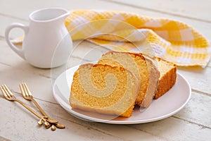 Butter cake sliced on white plate