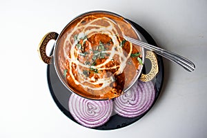 Butter Chicken karahi or chicken makhni with onion and chili served in a dish isolated on grey background top view of bangladesh