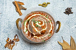 Butter Chicken karahi or chicken makhni with onion and chili served in a dish isolated on grey background top view of bangladesh