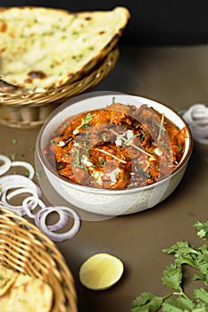 Butter chicken served with Homemade Indian Naan Bread Murgh Makhani