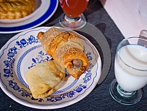 Butter croissant with sesame seeds baked with fresh glass of mil