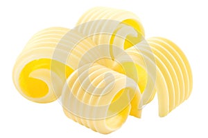 Butter curls rolled up, a group of four,  isolated