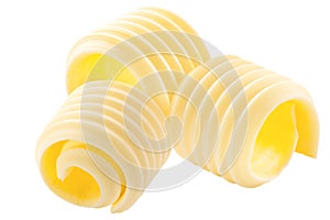 Butter curls rolled up, a group of three,  isolated