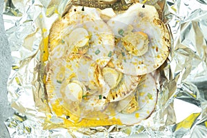 Butter grilled scallops, BBQ fresh seafood  served in foil paper placed on box