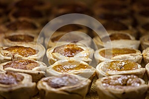 Butter tarts, small size, for sale on the shelf of a Canadian Market of Toronto. Butter tart is symbol of canadian cuisine photo
