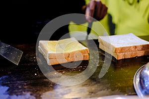 Butter toast cooking on hot pan