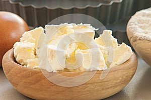 Butter on white wood table