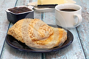 Buttered and Grilled Hard Roll with coffee