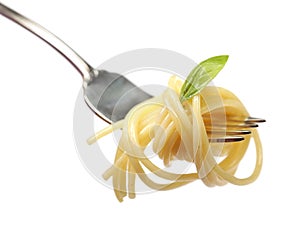 Buttered pasta with basil on a fork