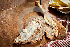 Buttered rye bread with butter spreader