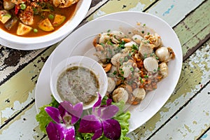 Buttered shellfish cooked with thai spice