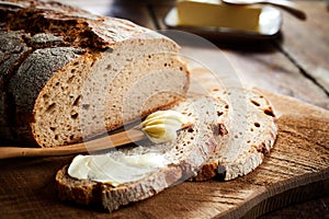 Buttered slice of freshly bake rye bread