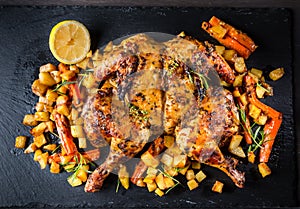Butterflied grilled whole chicken with roasted vegetables and potatoes