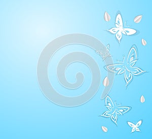 Butterflies from paper on a blue background
