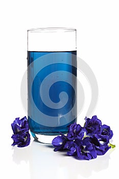 Butterfly pea drink for health in glass on white background