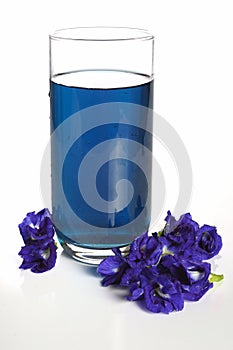 Butterfly pea drink for health in glass on white background