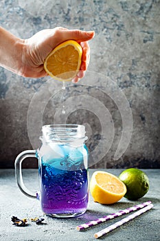 Butterfly pea flower blue iced tea or lemonade. Healthy detox herbal drink.