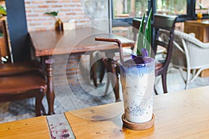 Butterfly pea juice and milk in a glass