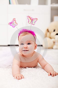 Butterfly princess crawling - baby girl on the floor