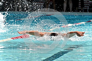 Butterfly swimmer during a swim meet