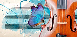 Butterfly, violin and notes. Blue morpho butterfly and violin. Melody concept. Photo of old music sheet in blue watercolor paint.