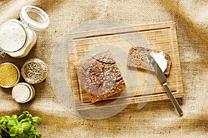 Buttering a slice of bread vivid kitchen scene