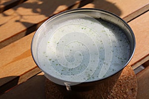 Buttermilk with herbs and cucumber photo