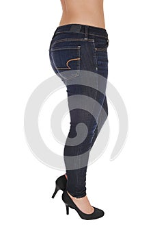 The buttocks legs and hip of a woman in jeans