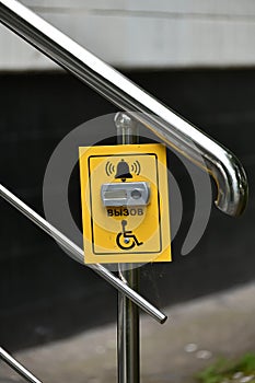 Button for calling help for disabled on handrail of the stairs, Russia