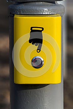 Button for enabling pedestrian traffic lights. Button call the emergency services