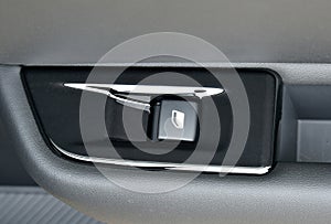 The button for raising the windows in the car